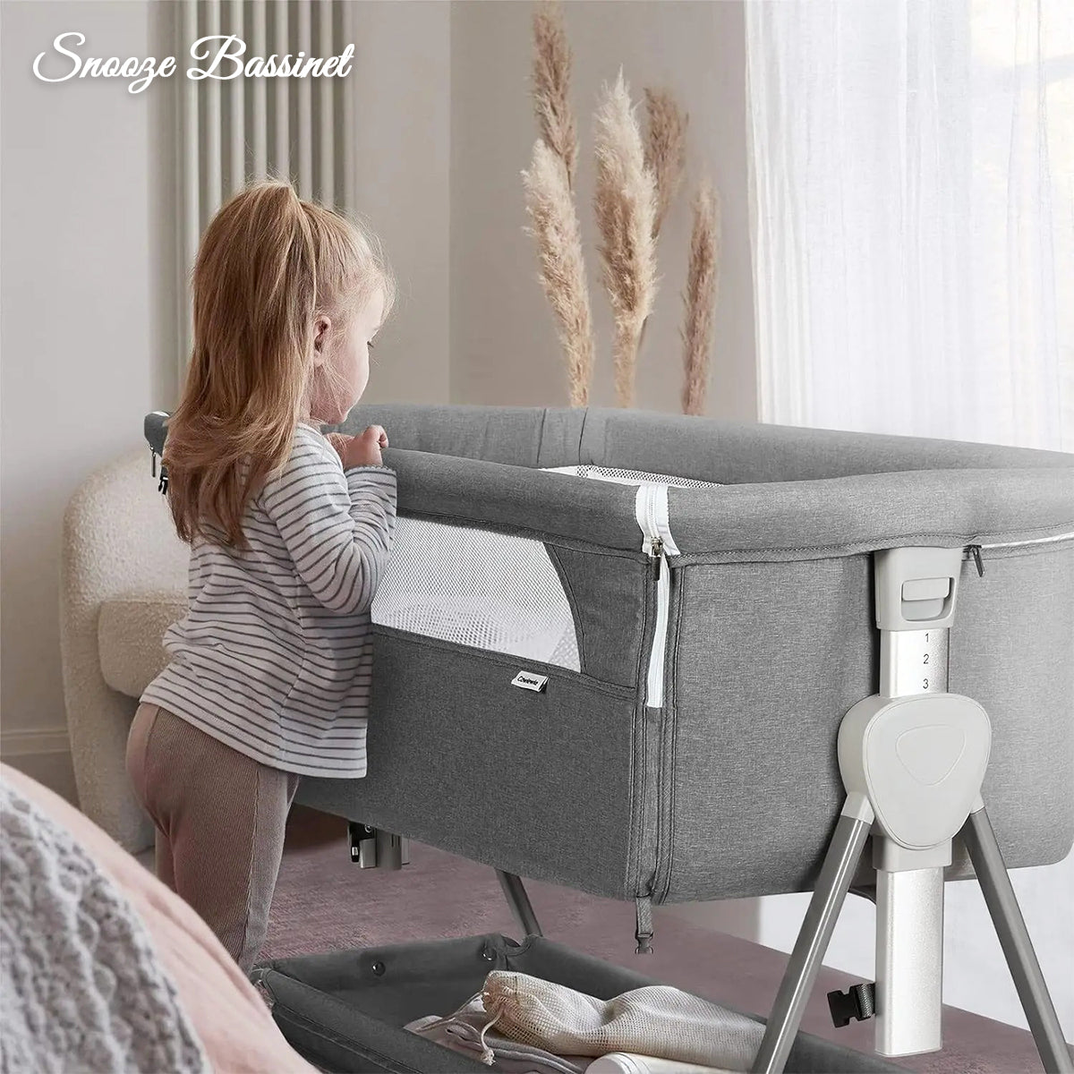 Snooze Bassinet placed next to child for easy access and comfort